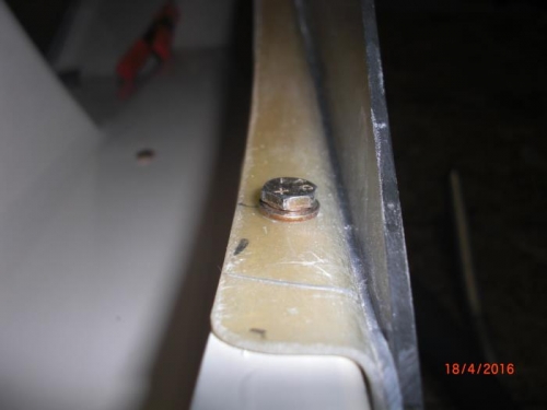 first door mounting bolt installed on half door