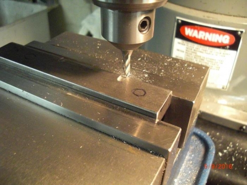 milling slots into tip weightsto allow forrivet heads