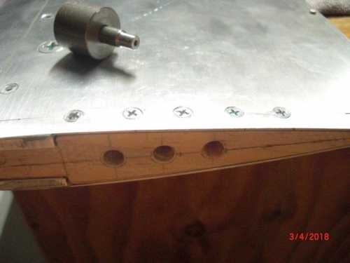 screws forr tip plug installed. Drill guide is also shown