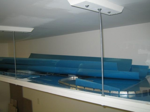 Large skins stored on suspended shelf