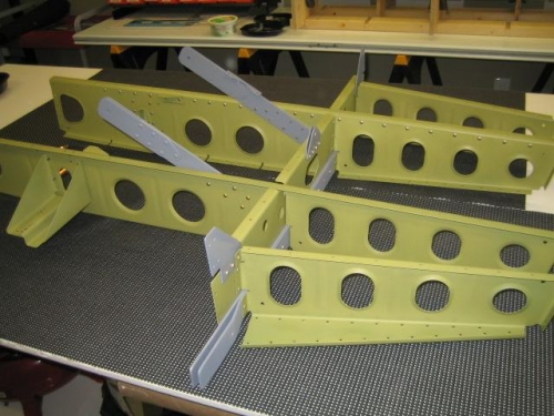 Seat ribs riveted onto rear spar attach bulkhead