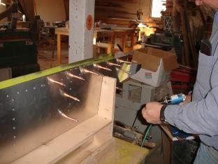 Rivetting the skin while in the jig