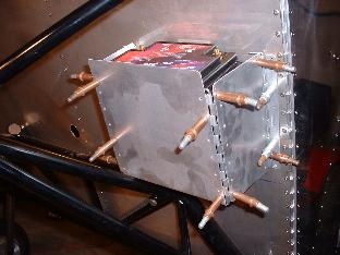 Battery box clecoed to firewall