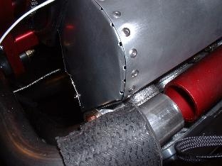 Install screw at super tin/baffle junction