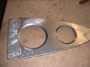 Rib with gusset riveted