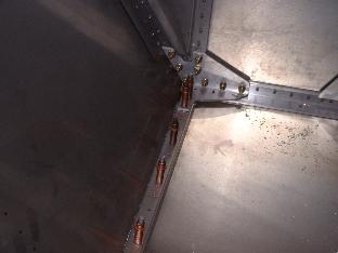 Inside of firewall at lower motor mount