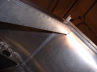 Riveted bottom of cross box