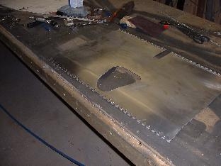 Forward hinge mounted on lower seat