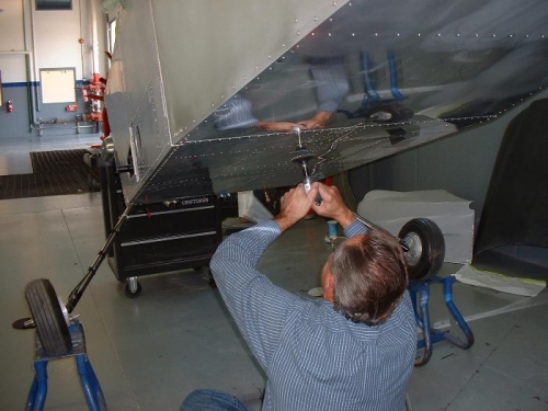 Bill prepping bottom of fuselage
