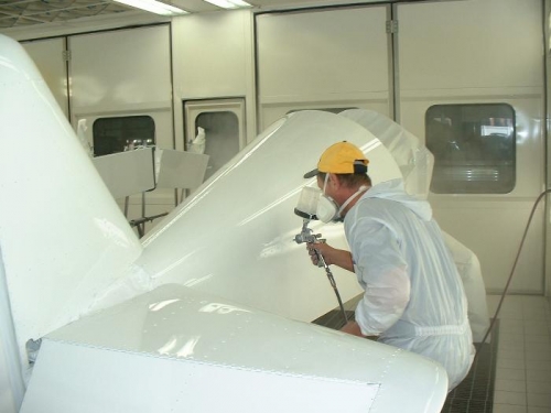 Applying paint to fuselage