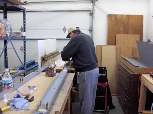 Clecoing brackets to the spar