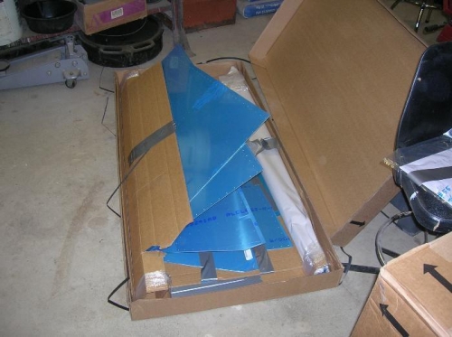 Open box containing aluminum skins for the tail surfaces