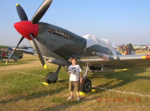 Tanner and his favorite airplane, a British Spitfire.