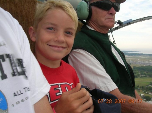 Colten at 500 feet over Airventure, who wouldn't smile.