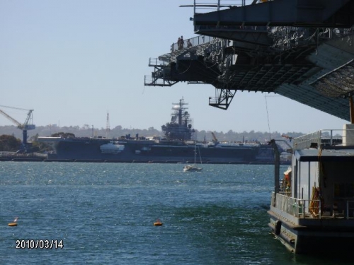 USS Ronald Reagan in distance beyond Midway.
