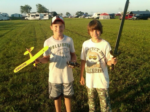 Colten with his RC Cub and Tanner with sword.