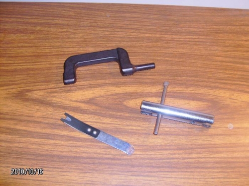 Offset rivet tool, fastener holder, rod end bearing tool
