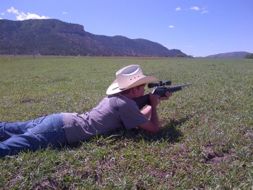 Cowboy Tanner shooting prairie dogs.
