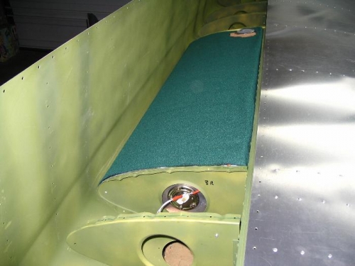 Fuel tank with connections, wrapped in a felt blanket with cork strip ends