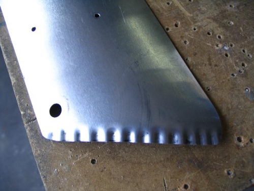 Fluted edge to tuck under front top skin