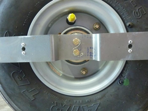 Safety wire on axle bolts used to mount wheel fairings