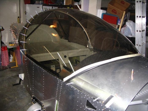 The rubber weatherstrip temporarily held on by masking tape