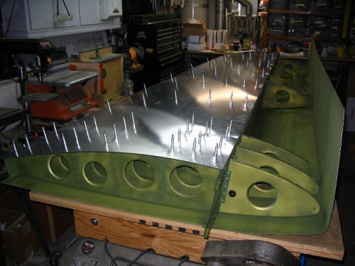 Left wing riveted on bottom and flipped
