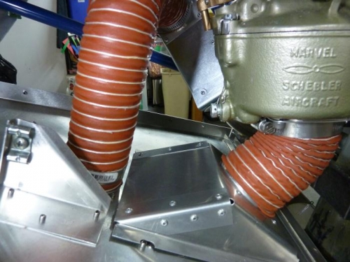 Carb heat hose on the left and air filter to carb hose on right