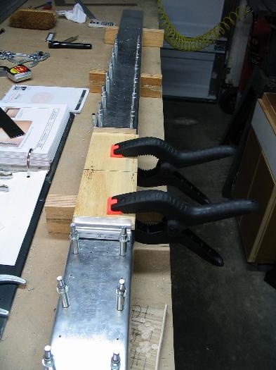 Clamped plywood template on front of spar