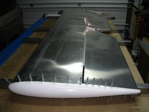 In position, but missing about 60 rivets along the hinge