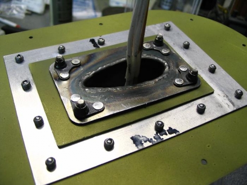 Underside of access cover with riveted nutplates