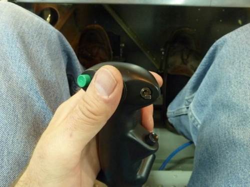 Thumb on the hat switch that controls bi-directional trim