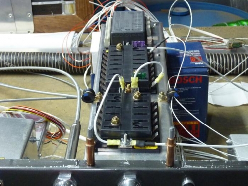 The bottom of the center channel support / fuse & relay support