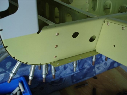 Riveted F-807 bulkhead to outboard seat ribs