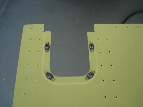 Nutplates riveted to cover plate opening