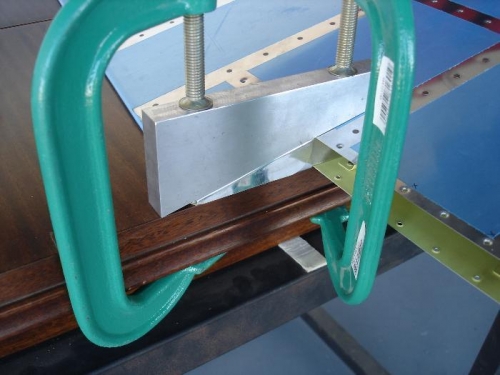 Bending blocks clamped in position