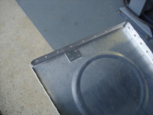 Tooling hole cover plate