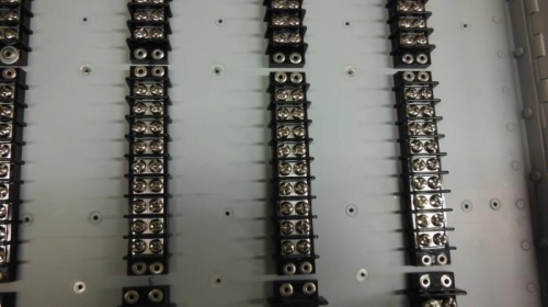 Close-up of terminal strips mounted on panel