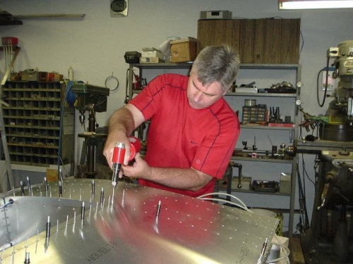 Scott setting rivets.