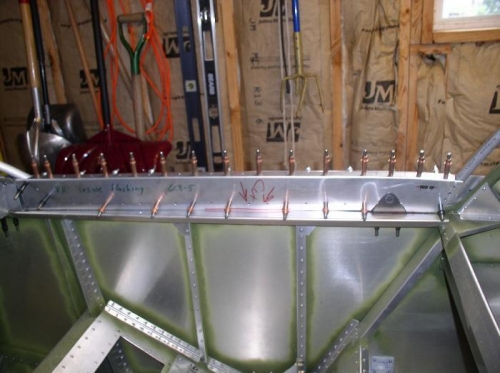 Inside cover clecoed into place, with notch for latch and slot to release latch.