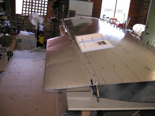 Aileron clecoed in place to check cutout on top of wing