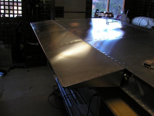 O/B view wing upside down and flap mounted