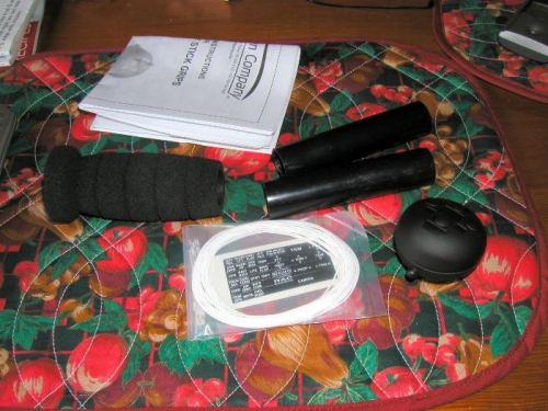 Whats in the bag, one grip, one 4 way trim and ptt head, wire and stickers