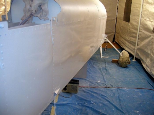 Left rear, you can see the reflection of the spray booth in the side of the fuselage