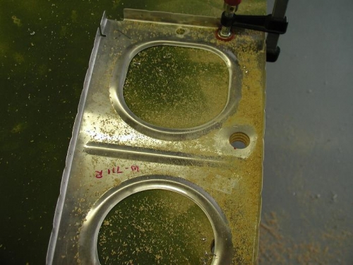 Drilled over a pice of wood for support.