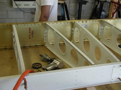 Jenny had a stiff neck all day but the little trooper helped rivet the ribs to the spar.