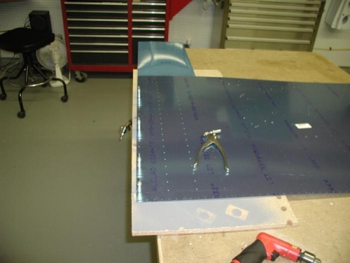 Drilling the holes in the wing walk doubler that is under the inboard top skin.