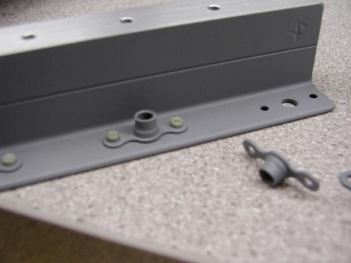 Riveted the K1000-3 Plate nuts to the fuel tank brackets after priming.