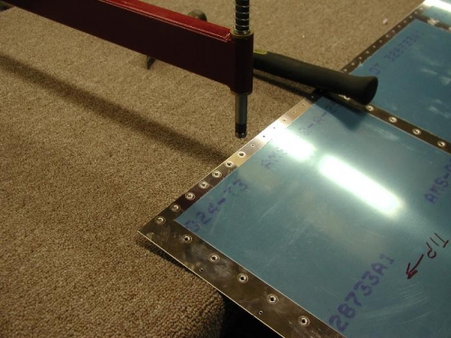 Dimpling the left wings leading edge.