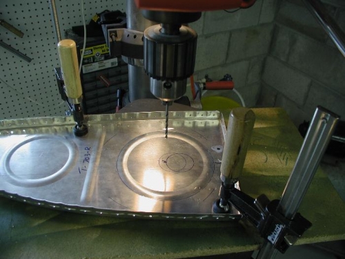 Cutting the inspection hole in the inboard rib for the left tank in the drill press.